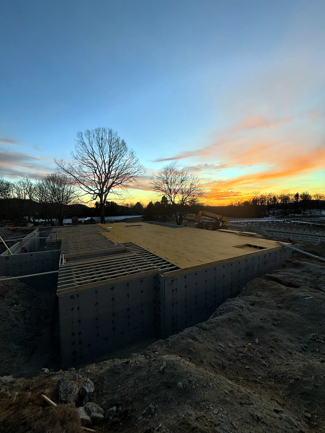 Custom home foundation at sunset